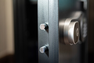 A safety box with heavy-thick steel door is opening , close-up and selective focus. Financial...