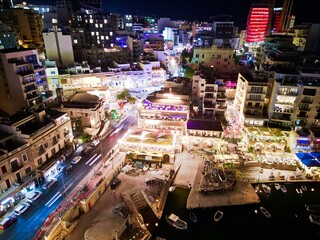 Aerial drone night shot of St. Julian's Bay in Malta