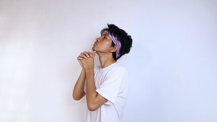 Young man in white shirt warming up sports on the head