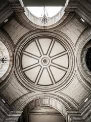 Aged stonework archway and ceiling structure in a historic building