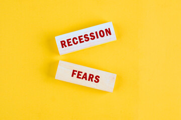 Business and recession fears concept. Copy space. Concept words Recession fears a conceptual phrase on wooden blocks lying on a beautiful uniform tone