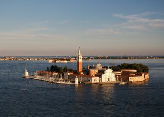 Fototapeta premium Aerial view of San Giorgio Maggiore church on an island at golden hour in Venice, Italy