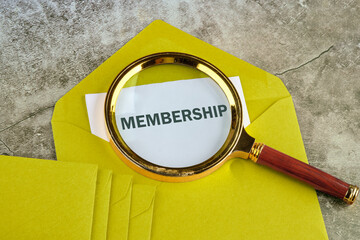 Membership text. Concept image. MEMBERSHIP word written on paper sticking out of a mustard-colored envelope