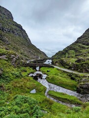 the valley in a green valley with a road passing by