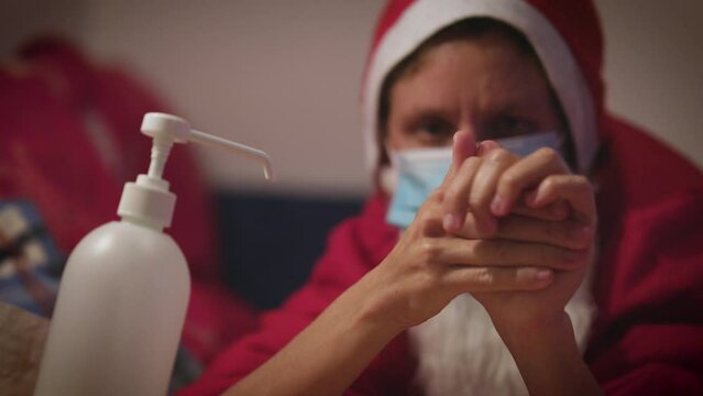 Woman Santa in Costume in Bed with Flue - Facial Mask and Disinfection - Quarantine Concept