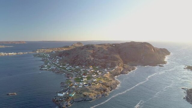 Drone footage over landscape of Fogo Island in Cape Verde by the water at sunset