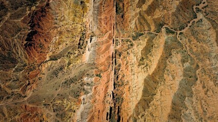 Aerial view of the stunning rock formations of Skazka Canyon at the shore of Issa-Kul Lake.