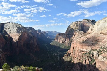 a scenic landscape featuring high cliffs, gorges, and valleys
