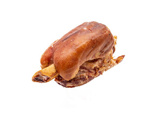 Close-up of a succulent pork knuckle served on a pristine white background