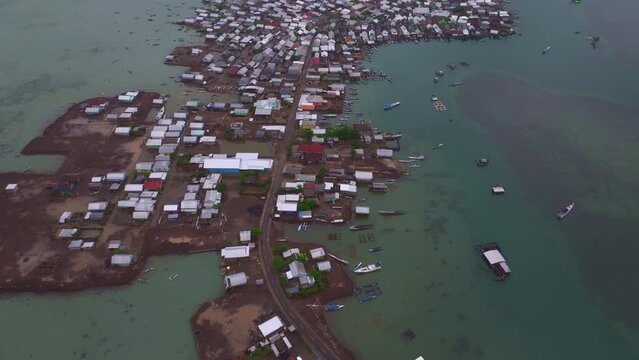 Aerial view of fishing village at sunrise on Bungin Island, Sumbawa, Indonesia.
