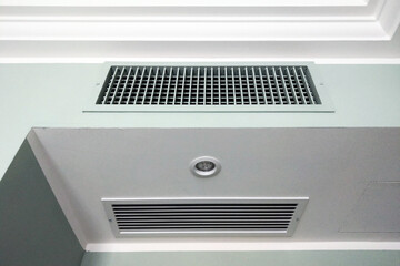 Modern Home HVAC Ventilation System Close-Up with Ceiling Air Vent and Light Fixture - Suitable for Home Improvement Projects