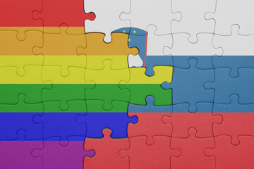 Fototapeta premium puzzle with the colourful national flag of slovenia and rainbow gay pride flag .