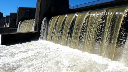 Hydroelectric power station with sluice on the Danube with open drain at high water, Germany