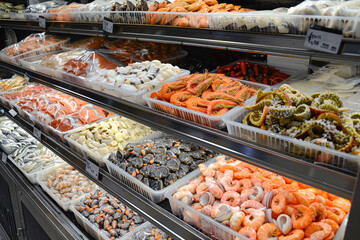 Various seafood on the shelves of the fish market in Norway 