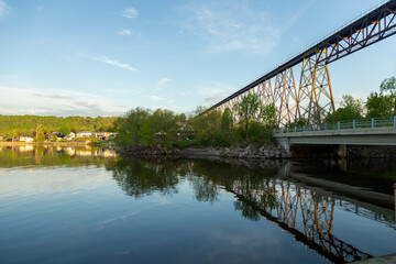 View of the 1908 railway trestle bridge over the Cap-Rouge River seen from the St. Lawrence River shore during a sunny spring morning, Cap-Rouge area, Quebec City, Quebec, Canada