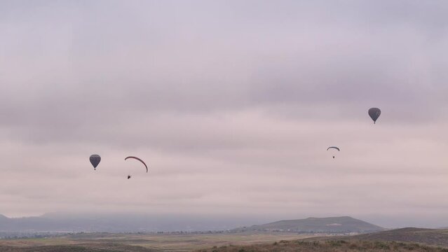 Temecula Balloon and Wine Festival Two Hot Air Balloons With Two Paragliders Shot by Drone