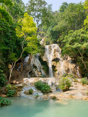 kuang si Waterfall cascade a turquoise pool surrounded by lush in the forest, luang prabang, laos