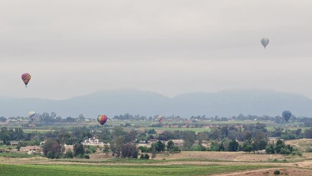 Temecula Balloon and Wine Festival Six Hot Air Balloons Visible as Drone Slowly Pulls Backwards