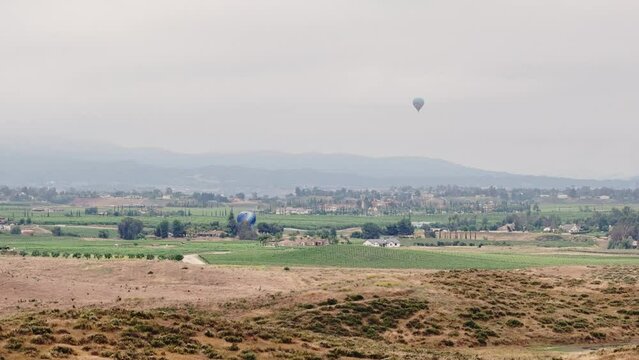 Temecula Balloon and Wine Festival Two Balloons While Drone Flies Sideways Right to Left