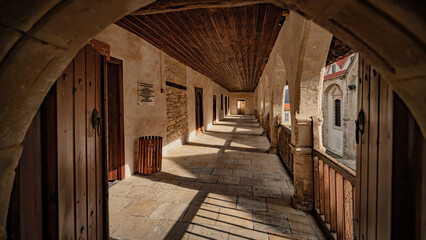 the view of a hallway in a medieval - era building