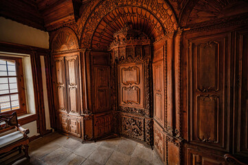 a big old looking room with old furniture and woodwork