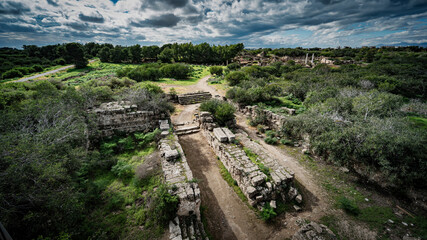 a group of old stone buildings sitting on top of grass