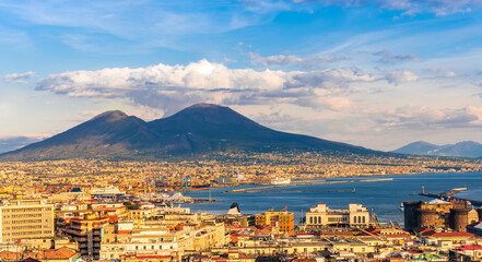 urban view on a Naples city with houses buildings and mount Vesuveus with amazing cloudy sky on...