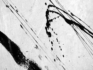 stain of black acrylic paint splash on rough grey textured floor