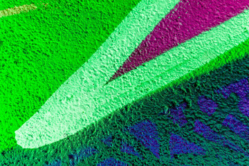 Colorful beautiful background of urban spray drawing graffiti on city wall. Bright vivid pattern of  modern art for wallpaper and design.