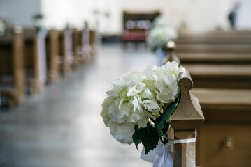 Beautifully decorated church for a wedding ceremony, adorned with flowers