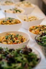 Food bowls arranged on a beautifully set table for multiple guests