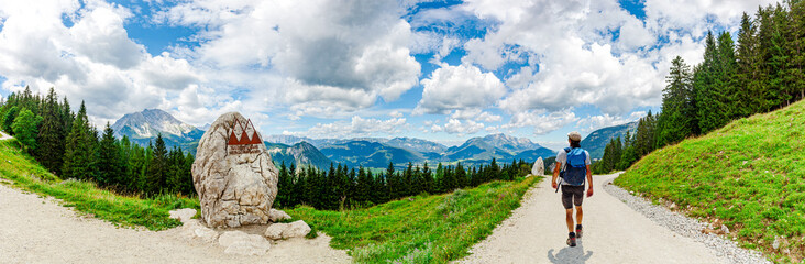 Panoramic Landscape Scenery. Mountain Jenner, Route Mitterkaseralm. Man Hiking in the National park...