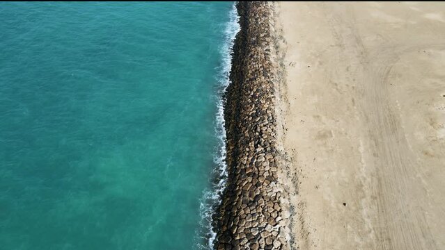 Aerial view of Abu Dhabi city against the sea Barrier in Mena area, United Arab Emirates