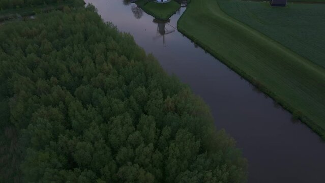 Aerial view of De Vlinder windmill, river Linge, and sunrise, Deil, Gelderland, Netherlands.