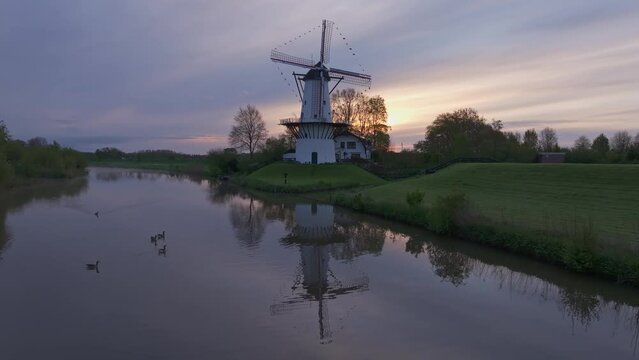 Aerial view of De Vlinder windmill, river Linge, at sunrise, Deil, Gelderland, Netherlands.