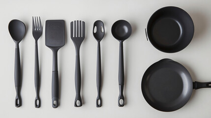 Set of kitchen utensils and dinnerware on light background
