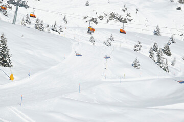 Snow-covered ski slope with a ski lift in Bettmeralp, Switzerland