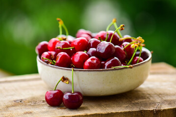 Fresh ripe cherries in a bowl
