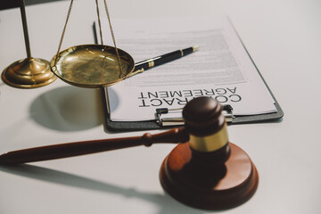 Lawyer, legal advisor, businessman brainstorming information on agreement details Business contracts in legal processing books for accuracy in contract documents. joint financial investment.