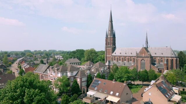 Crane down next to catholic church in Budel Cranendonck Brabant village