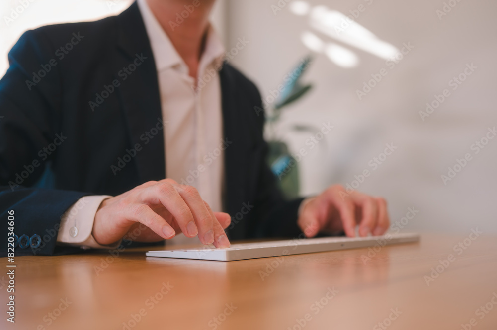 Poster hands of an office man typing on computer keyboard