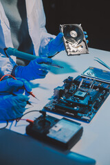 Close up of Technician measuring voltage electronic circuit board television, Service after sale fix electric equipment within insurance.