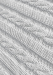 White background vertical texture of knitted pattern with pigtail