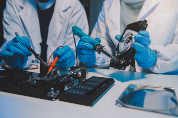 Close up of Technician measuring voltage electronic circuit board television, Service after sale...