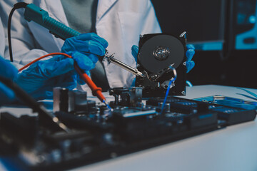 Naklejka premium Close up of Technician measuring voltage electronic circuit board television, Service after sale fix electric equipment within insurance.