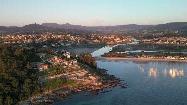 Aerial view of coastal town with mountains and river, Monte Lourido, Nigran, Spain.