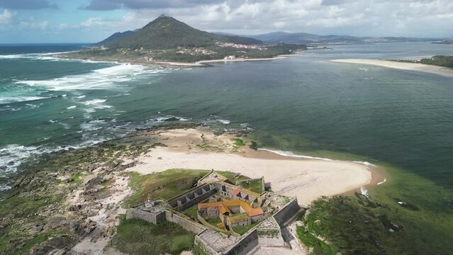 Aerial view of Forte da Insua with ocean, beach, and mountain, Caminha, Viana do Castelo, Portugal.