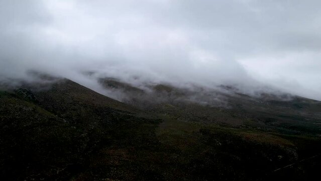 Aerial view of misty mountain range with low cloud, Drie Kuilen Nature Reserve, Western Cape, South Africa.