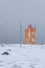 Lighthouse during snowstorm - Iceland