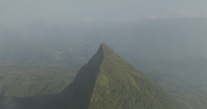 Aerial view of foggy Cerro Tusa mountain in Venecia, Antioquia, Colombia.
